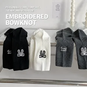 Women's crew socks featuring bow embroidery and Candy Sweet lettering in black white grey