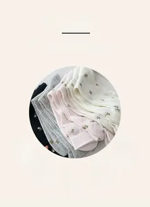 Detail view of cotton floral mesh socks highlighting breathable and soft fabric texture