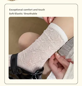 Detail of floral lace mesh socks in cream white with breathable and elastic texture