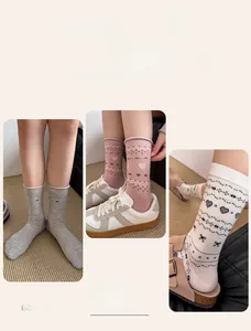 Detail of heart pattern cotton socks showing double needle weaving in multiple colors