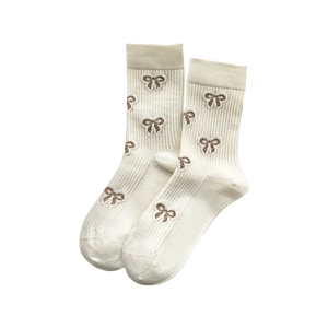 Cotton mid-calf socks with rib texture and brown bow embroidery on cream white base