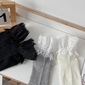 Set of retro Lolita lace ruffled socks in black, gray, and white with ribbed cotton texture
