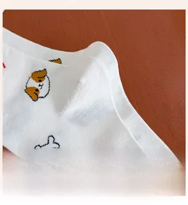 Detail of reinforced heel and cute cartoon dog print on white cotton socks