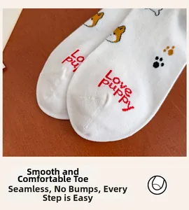 Detail of seamless toe construction on white cotton socks with cute puppy pattern