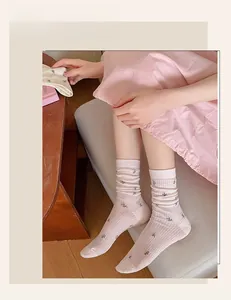 Detail of breathable pink floral mesh cotton socks featuring delicate knit embroidery