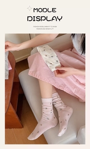 Detail of floral embroidery and ribbed texture on cotton crew socks for women