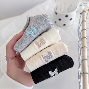 Set of four cotton crew socks with butterfly embroidery and delicate ribbed texture