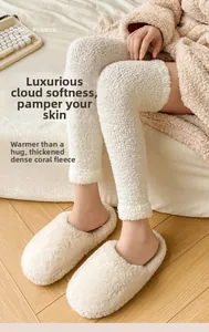 Close-up of white coral fleece over-knee socks featuring thick velvet texture and soft knit