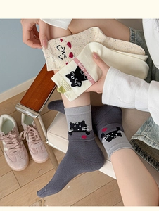 Detail showing cartoon cat pattern and Cute Cat text on soft cotton knit socks