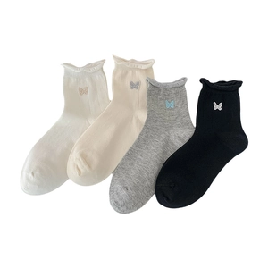 Embroidered bow knit crew socks for women in four classic colors with ruffled edges