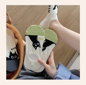 Detail of cute cat pattern socks with non-slip silicone heel and breathable cotton knit
