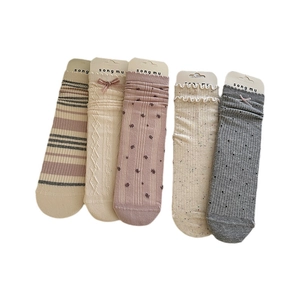 Five pairs of cream lace crew socks with bow knots and floral patterns in autumn tones