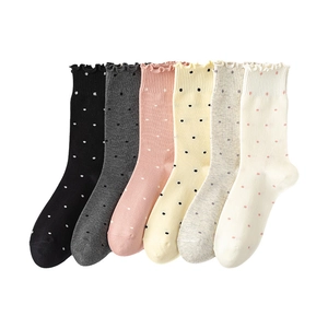 Six pairs of polka dot cotton socks for women with ruffled cuffs in various colors