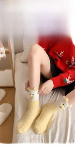 Detail of coral fleece thick socks with yellow cat embroidery and 3D ears detail