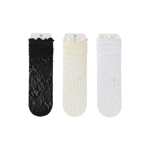 Three pairs of ballet-style lace ruffle socks in black, beige, and white floral mesh