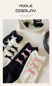 Detailed view of ballet style ribbed socks featuring velvet bows in black and pink tones