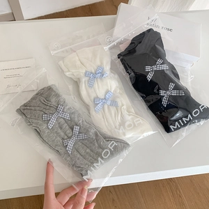 Sweet Lolita style bow mesh socks in black, white, and gray colors with vertical stripes