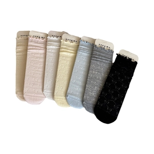 Set of 7 colors hollow out bow pattern crew socks with frill trim and wood ear edges