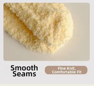 Detail of soft yellow coral fleece socks showing flat seam and delicate knit texture