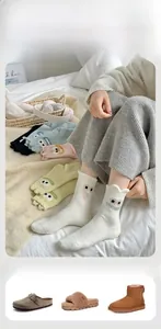 Detail of warm cartoon socks with thick coral fleece texture and 3D eye embroidery
