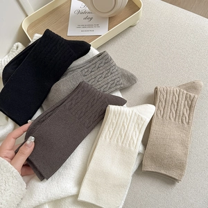 Thick winter thermal crew socks in earth tones with stylish cable knit texture for women