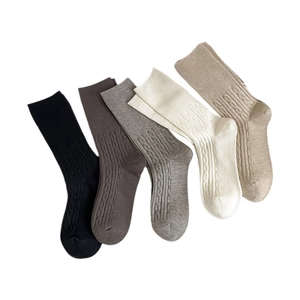 Five pairs of winter thick thermal cable knit mid-calf socks in earthy solid colors