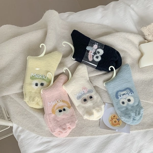 Thick warm fleece socks for women featuring colorful cartoon eyes and fuzzy texture