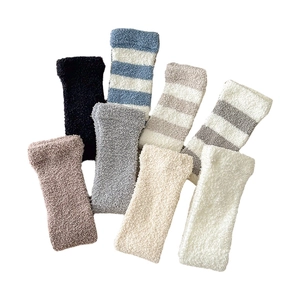 Thick coral fleece knee-high warming socks in various striped and solid colors