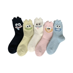Five pairs of thick cartoon monster coral fleece socks in assorted pastel colors