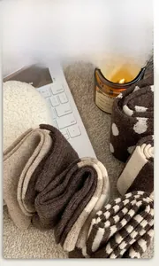 Close-up of thick wool socks with knit textures and warm earthy patterns in cozy setting