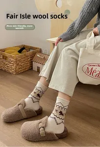 Detail of warm Fair Isle wool socks featuring classic brown patterns and cozy knit texture
