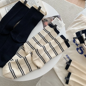 Fashionable Korean style crew socks with contrast stripes and woven heel labels
