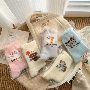 Five pairs of thick coral fleece winter socks with cute cartoon animal patterns