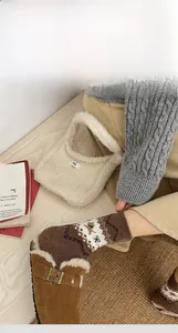 Detail of warm brown Fair Isle crew socks with Nordic patterns and elastic cuffs