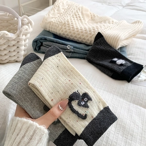 Japanese style gray cotton socks featuring cute cartoon cat patterns and ribbed texture