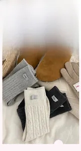 Close-up of three-color knitted wool socks with egg label and vertical rib texture