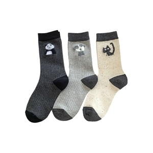 Three pairs of gray and beige ribbed cotton socks with cute cartoon animal patches