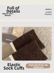 Detail of high-elasticity knitted cuff on striped brown and beige wool socks for women