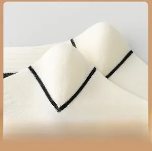 Detailed close-up showing the seamless knit heel of men's cotton socks with black stripes