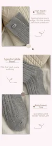 Detail view of grey wool socks with egg label featuring elastic cuffs and reinforced heel