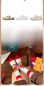 Detailed knit texture of Christmas crew socks with festive cartoon elk and Santa patterns