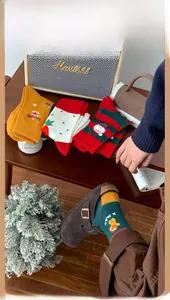 Detailed view of cozy Christmas cotton socks with festive patterns in a warm winter setting