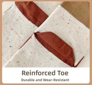 Macro detail of reinforced toe on speckled knit socks for durability and comfort