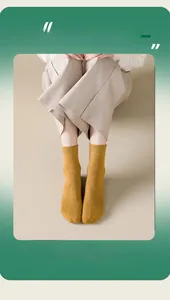 Detail of ginger yellow thermal crew socks with ribbed texture and thick cotton blend fabric