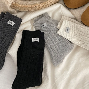 Thick ribbed wool mid-calf socks for women in four classic colors with egg label