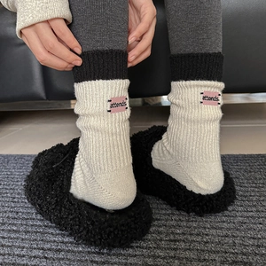 Off-white ribbed mid-calf knit socks with pink embroidered patch and teddy fleece slippers