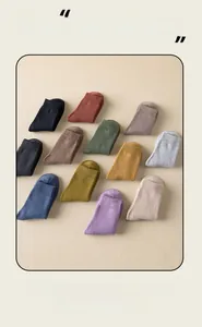 Detailed overhead view of twelve assorted Morandi color rib-knit thick thermal terry socks