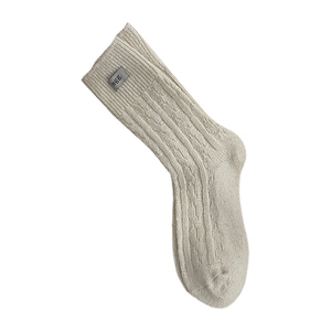Thick warm wool blend crew socks in cream beige with vertical knit texture and egg label