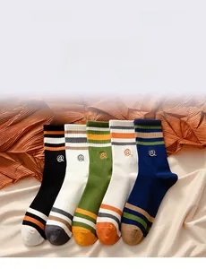 Set of five athletic crew socks with striped embroidery and ribbed cuffs in assorted colors