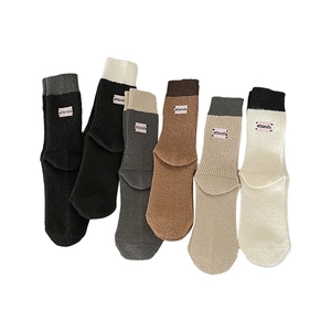 Six pairs of ribbed Morandi knit crew socks with ATT embroidery and color block cuffs